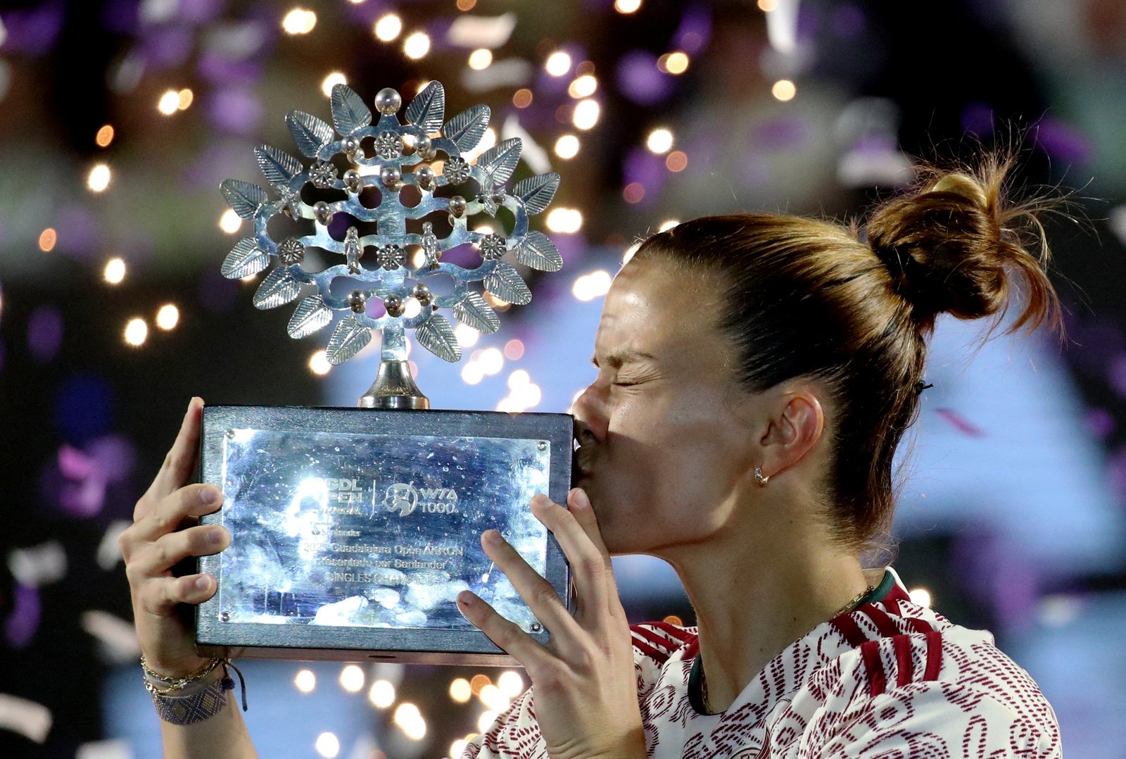 Tennis - WTA 1000 - Guadalajara Open - Panamerican Tennis Center, Guadalajara, Mexico - September 23, 2023 Greece's Maria Sakkari celebrates with the trophy after winning her final match against Caroline Dolehide of the U.S. REUTERS/Henry Romero